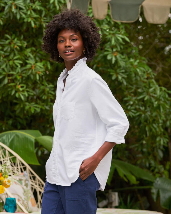 woman wearing Frank & Eileen Eileen Ruffle in White standing outdoors with greenery in the background well heeled stowe vt