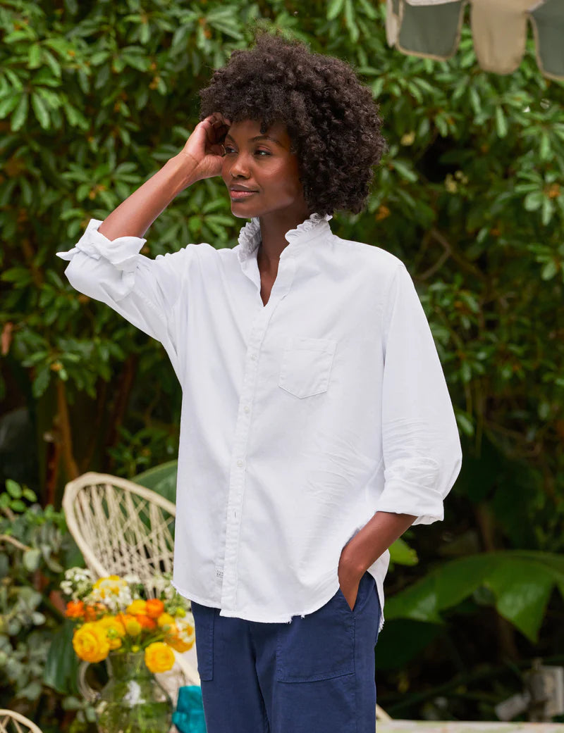 woman wearing Frank & Eileen Eileen Ruffle in White standing outdoors with greenery in the background well heeled stowe vt