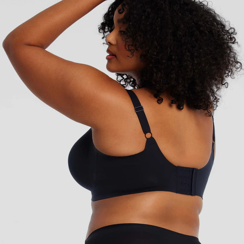 woman wearing Evelyn & Bobbie Starlette Plunge Bra in Black white background backview stowe vt boutique