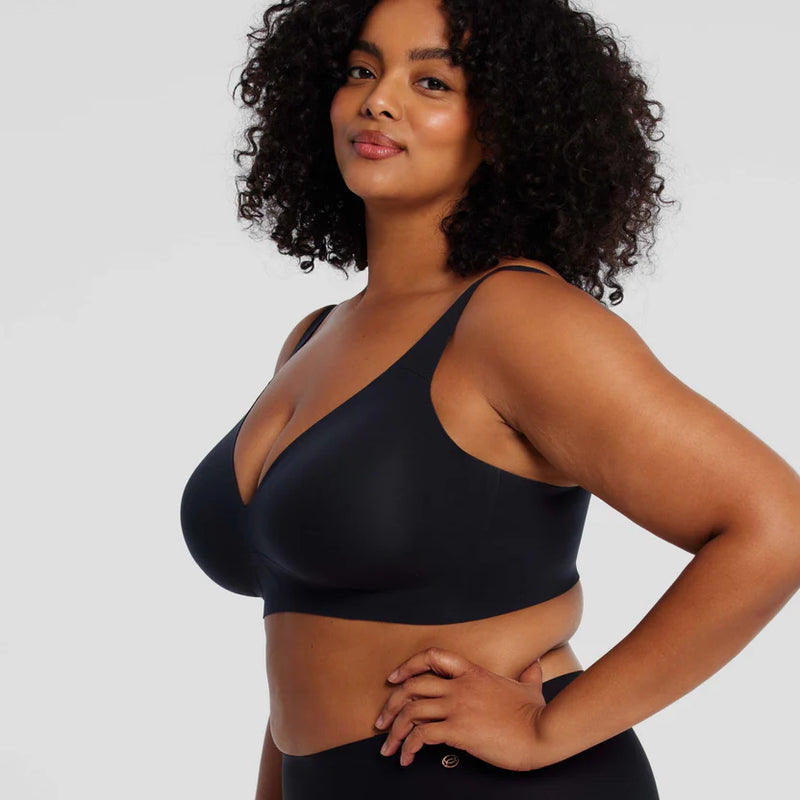 woman wearing Evelyn & Bobbie Starlette Plunge Bra in Black white background well heeled boutique stowe vt