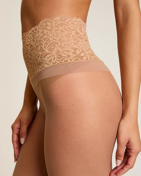 Woman wearing Commando The Sexy Sheer Tights in beige on a white background well heeled boutique stowe vt
