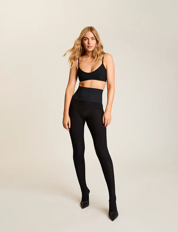 woman wearing Commando The Eclipse Opaque Matte Tight in Black on neutral background well heeled boutique