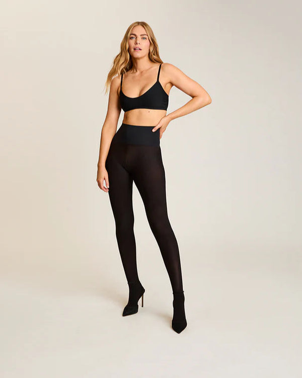 woman wearing Commando The Ultimate Opaque Matte Tights in Black on white background