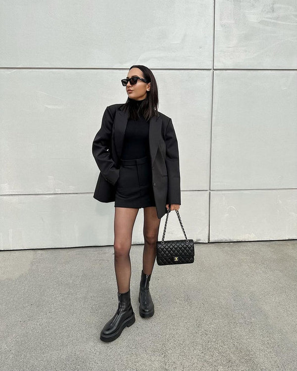 woman wearing Commando The Keeper Sheer Tights in Black against grey wall well heeled boutique stowe vt