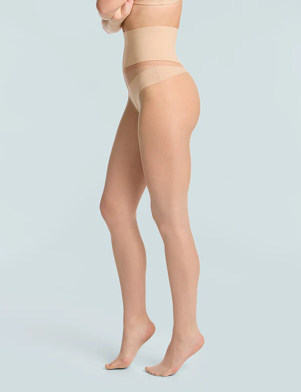 woman wearing Commando The Keeper Sheer Tights in Light Nude on white background