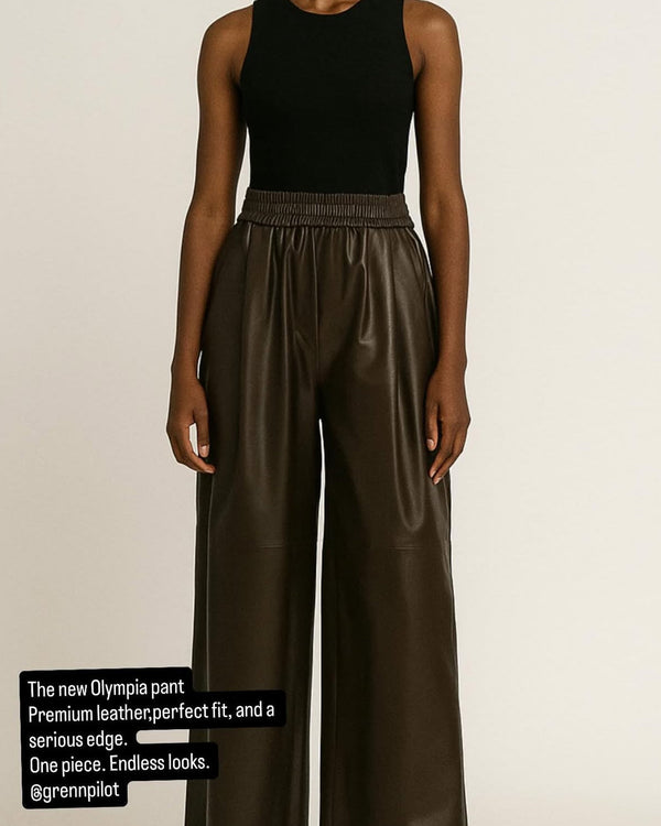 woman wearing Grenn Pilot Olympia Wide Leather Pants in brown chocolate on white background well heeled vt