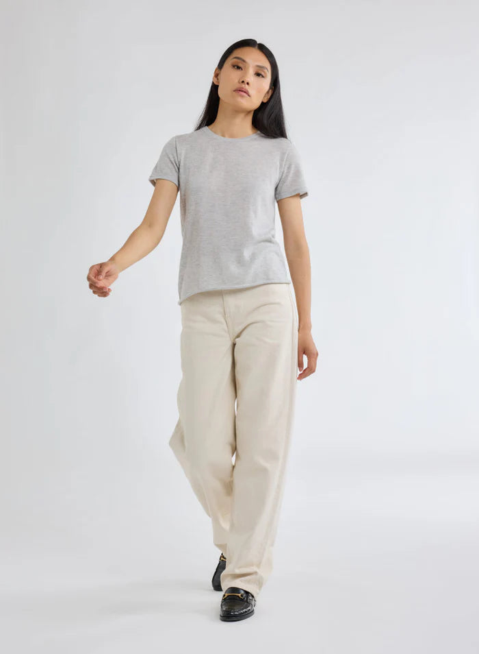 woman wearing Majestic Filatures Short Sleeve Cashmere Crewneck Brume Chine grey cashmere on white background well heeled vermont