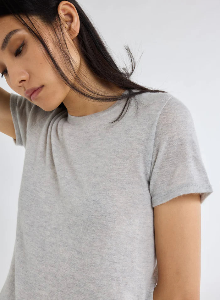 woman wearing Majestic Filatures Short Sleeve Cashmere Crewneck Brume Chine grey cashmere on white background well heeled vermont