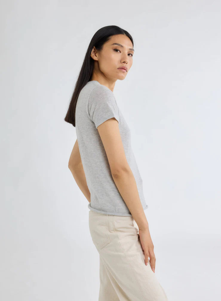 woman wearing Majestic Filatures Short Sleeve Cashmere Crewneck Brume Chine grey cashmere on white background well heeled vt