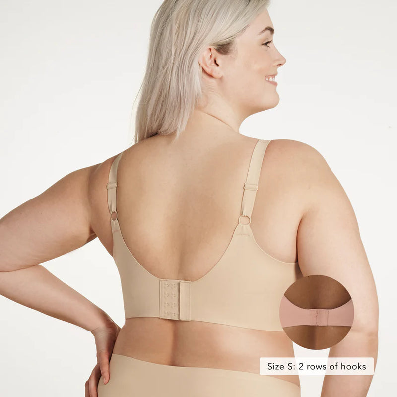 Woman wearing Evelyn & Bobbie Beyond Bra in Sand against a white background well heeled boutique stowe vt backview