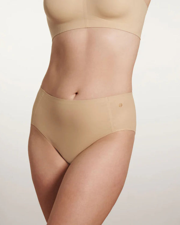 woman wearing Evelyn & Bobbie High Waisted Retro Bikini in Sand on white background