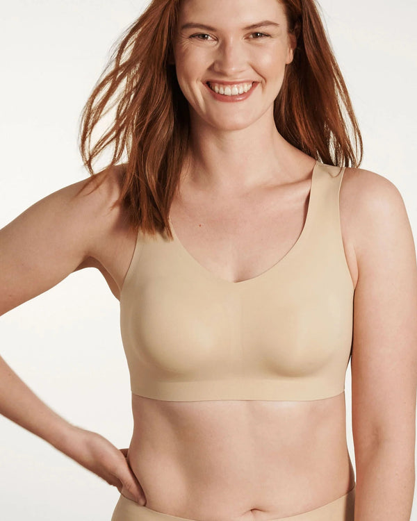 Woman wearing Evelyn & Bobbie Defy Bra in Sand against a plain background well heeled boutique stowe vt