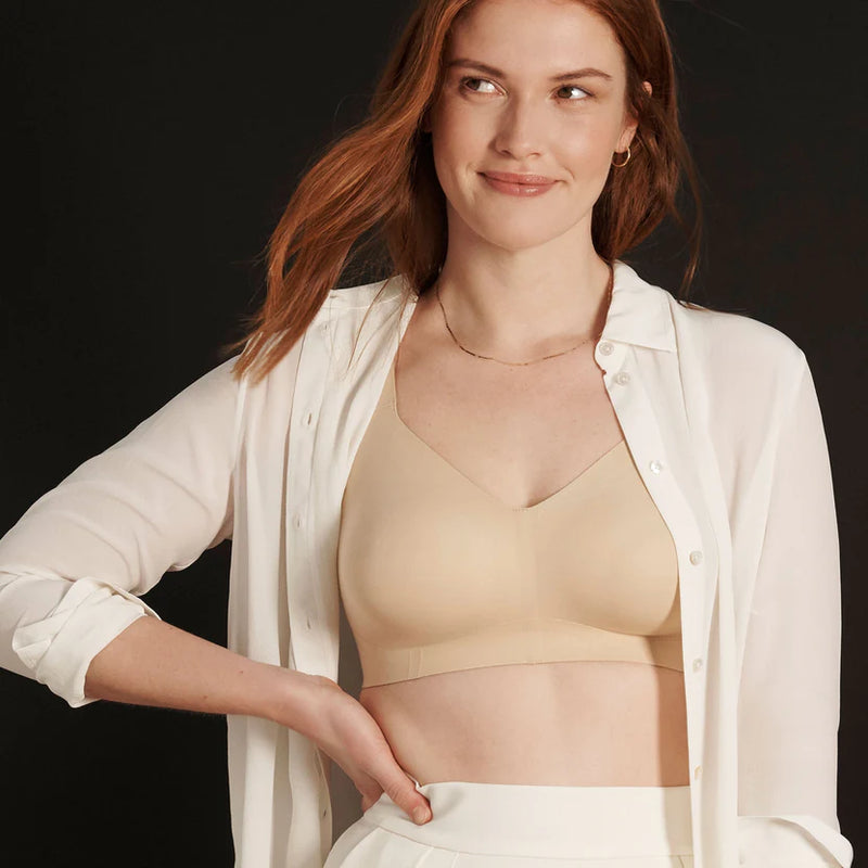 Woman wearing Evelyn & Bobbie Beyond Bra in Sand against a white background well heeled boutique stowe vt