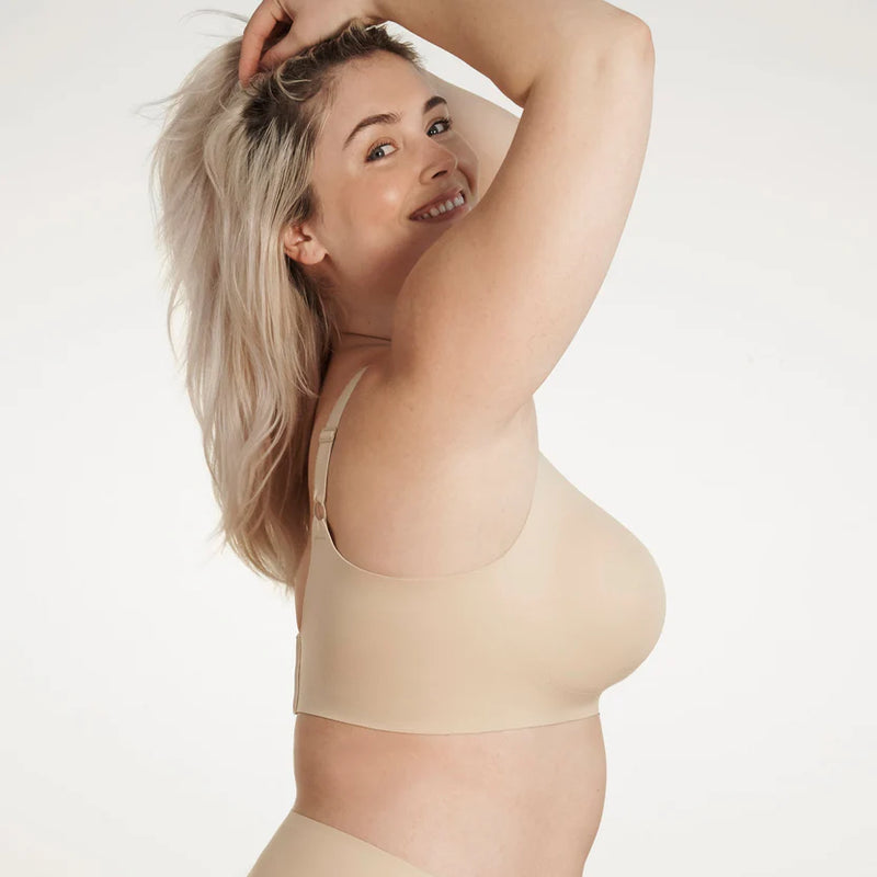 Woman wearing Evelyn & Bobbie Beyond Bra in Sand against a white background well heeled boutique stowe vt
