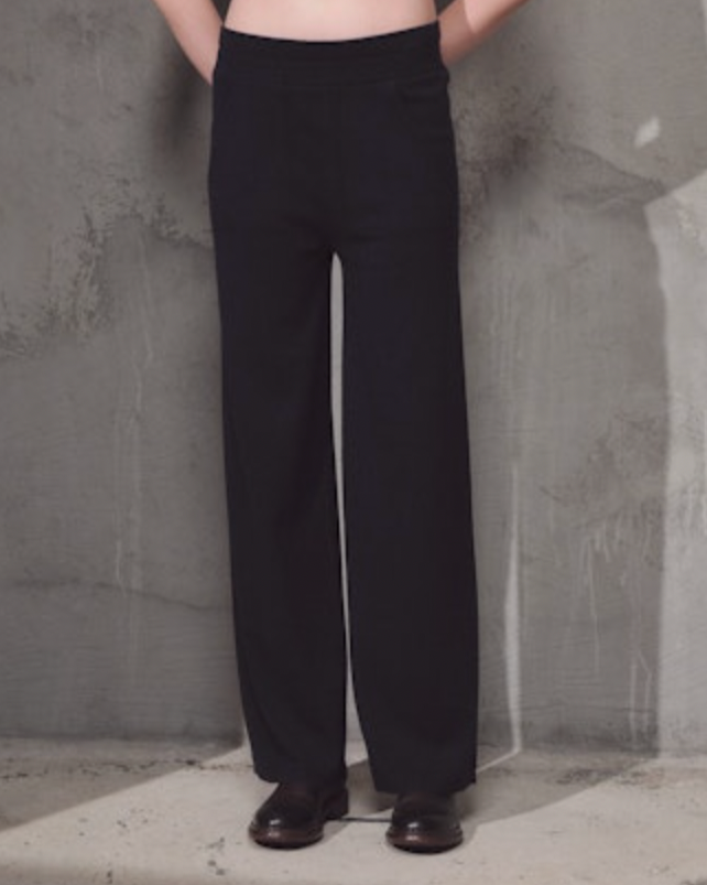 woman wearing Lamberto Losani Pantaloni in Dark Blue on grey wall well heeled vt