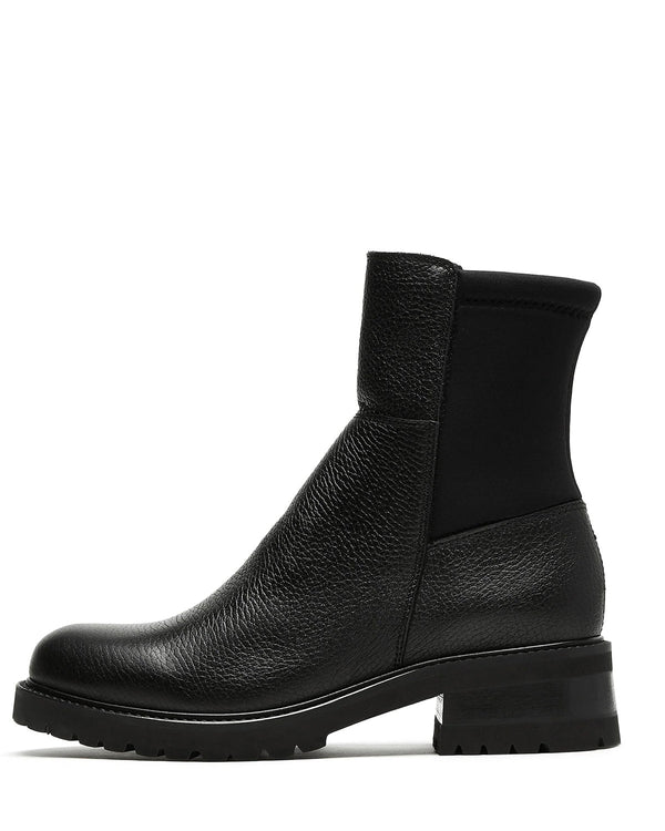 La Canadienne Calix Pebble Leather Bootie in Black Pebble on white background well heeled vt