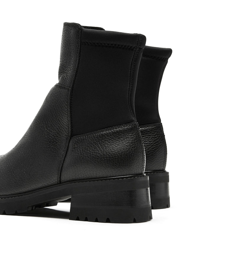 La Canadienne Calix Pebble Leather Bootie in Black Pebble on white background well heeled vt
