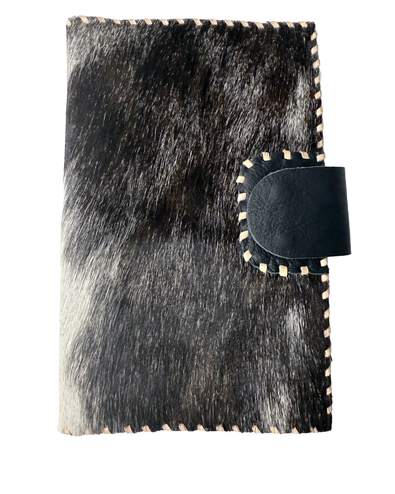Studio Caleidoscope Lao Passport Wallet in Black Cowprint at well heeled
