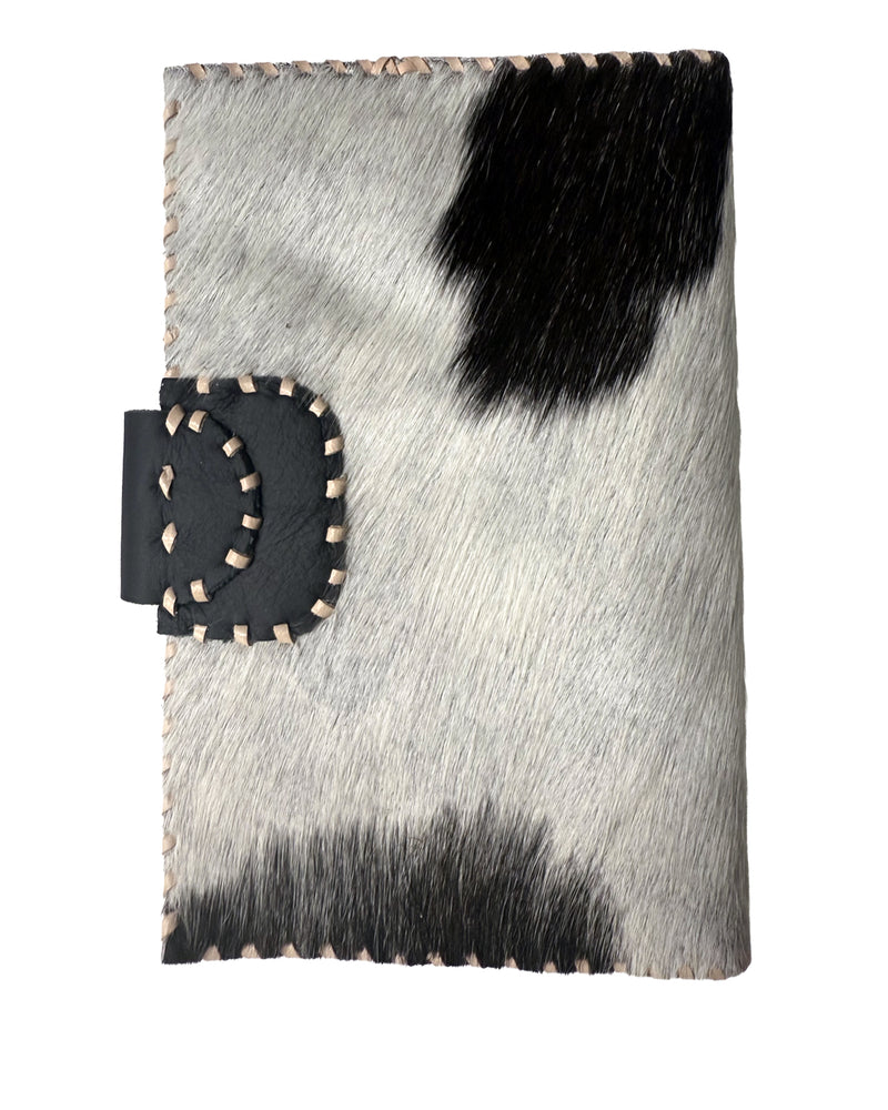 Studio Caleidoscope Lao Passport Wallet in Black Cowprint at well heeled vt
