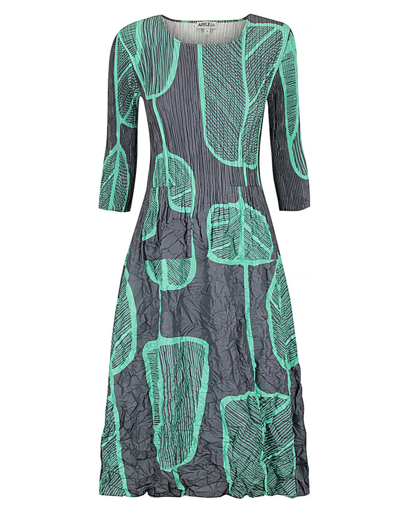 Alquema Smash Pocket Dress in Paddle with green leaf pattern on a white background at well heeled vermont boutique
