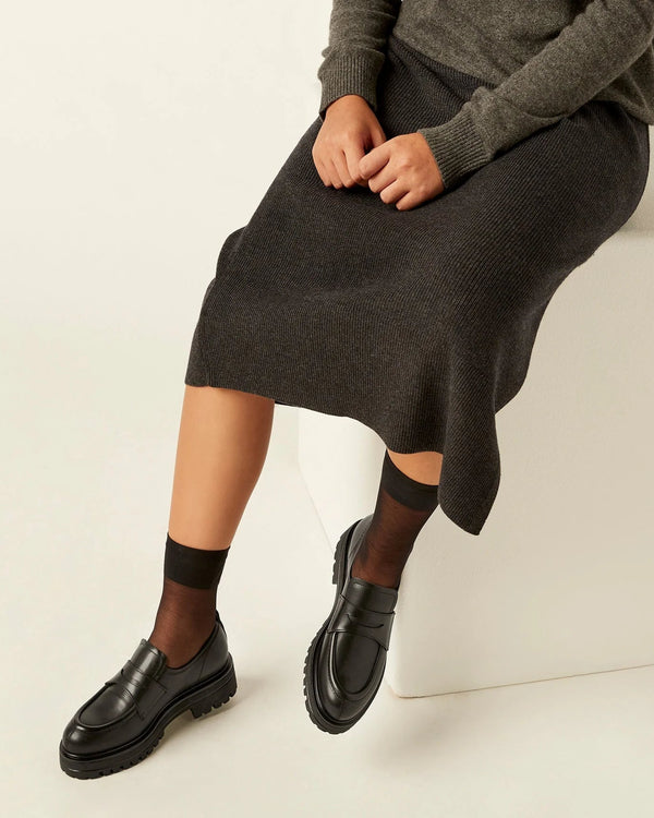 person wearing La Canadienne Gage Weatherproof Loafer in Black on white background well heeled stowe vermont