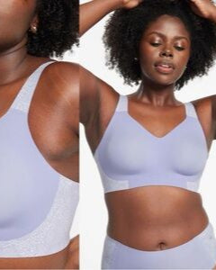 Woman wearing Evelyn & Bobbie Beyond Bra in Moonstone Lace with a plain background