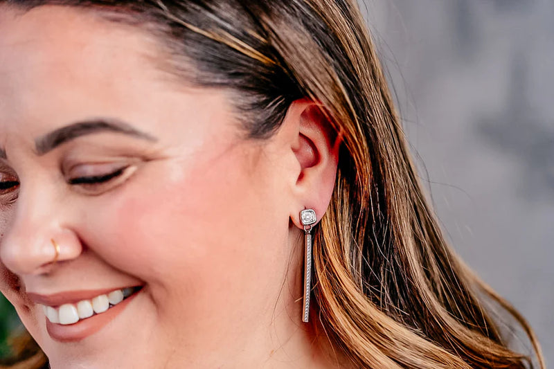 woman wearing Loni Paul Silver Crystal Bar Earrings Silver at well heeled